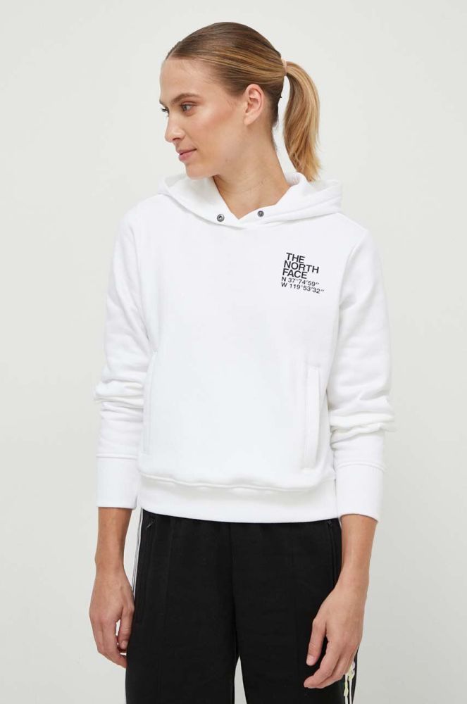 Бавовняна кофта The North Face жіноча колір білий з капюшоном з принтом (3545749)