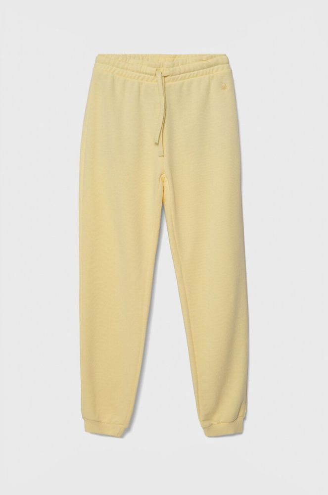 Дитячі бавовняні штани United Colors of Benetton колір жовтий однотонні (3391753)